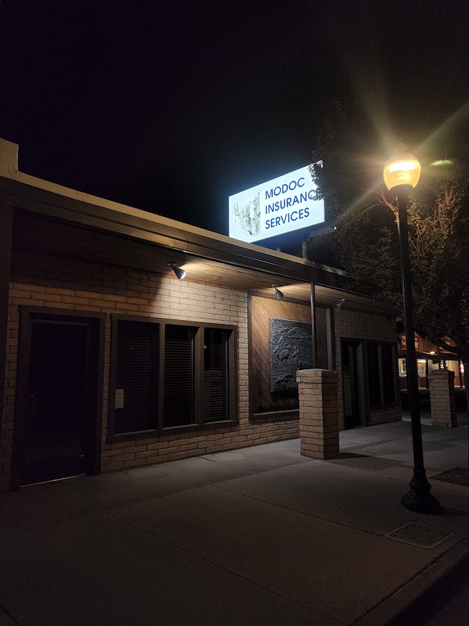 Modoc Insurance Services office and illuminated sign at 326 North Main Street, Alturas